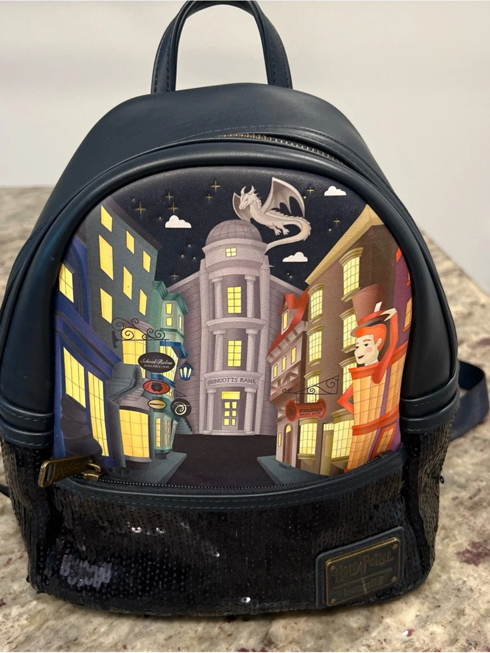 Black Mini Loungefly Backpack with Diagon Alley Illustration